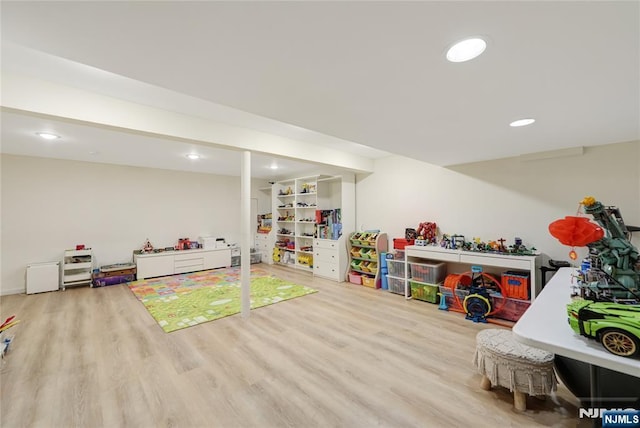 recreation room featuring wood finished floors and recessed lighting