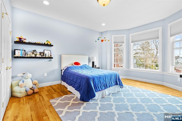 bedroom featuring recessed lighting, baseboards, and wood finished floors