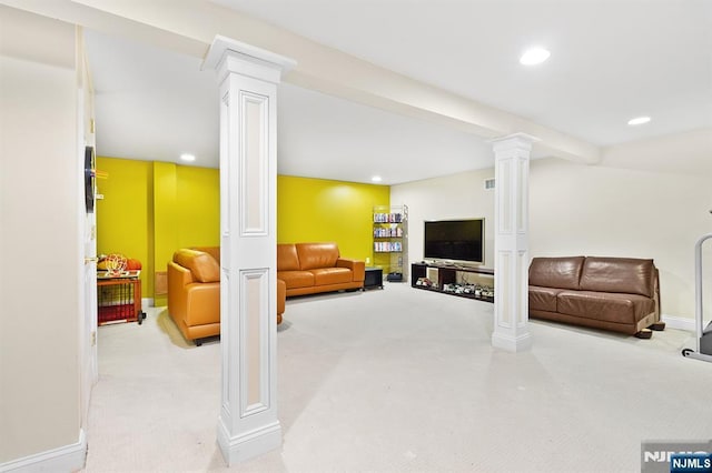 interior space featuring recessed lighting, baseboards, and decorative columns