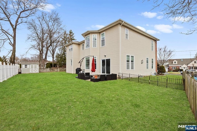 back of house featuring an outbuilding, a shed, outdoor lounge area, and a fenced backyard