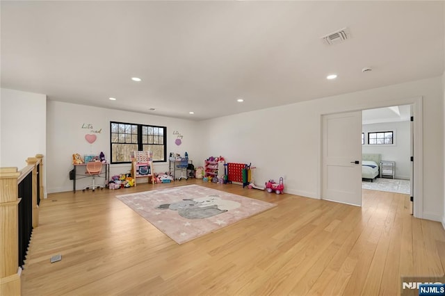 game room with baseboards, recessed lighting, visible vents, and light wood-style floors