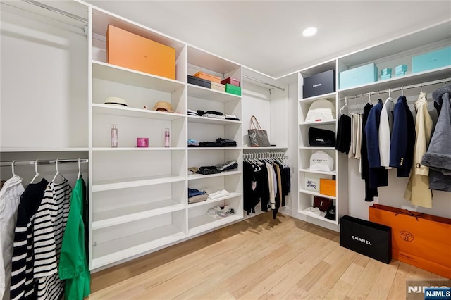 spacious closet with wood finished floors