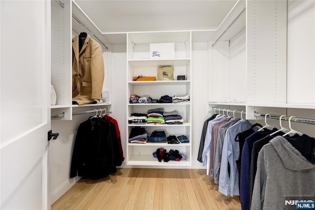 spacious closet with light wood-style flooring