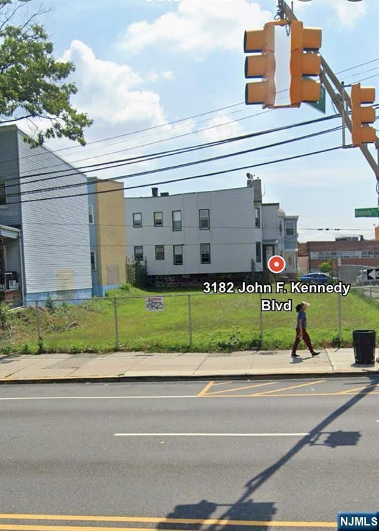 exterior space with sidewalks and curbs