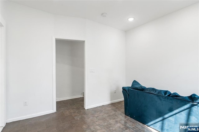 sitting room with baseboards and recessed lighting