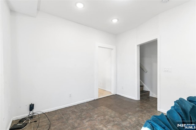 interior space featuring stairs, recessed lighting, and baseboards