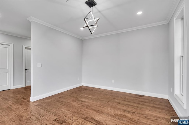 unfurnished room with baseboards, ornamental molding, wood finished floors, and recessed lighting