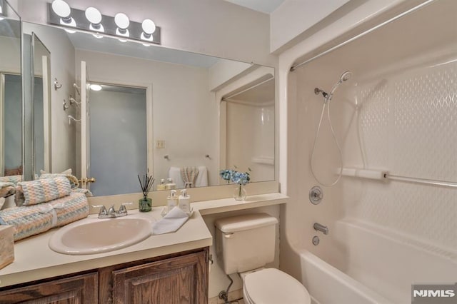 full bathroom with shower / bath combination, vanity, and toilet