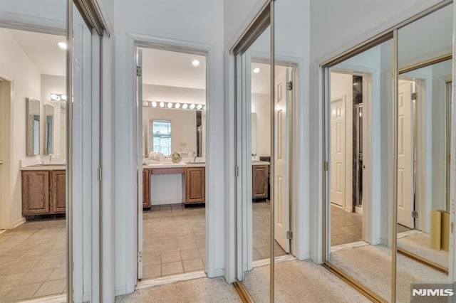 hall with light tile patterned flooring