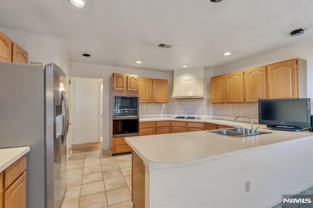 kitchen featuring a sink, custom exhaust hood, stainless steel appliances, backsplash, and light tile patterned flooring