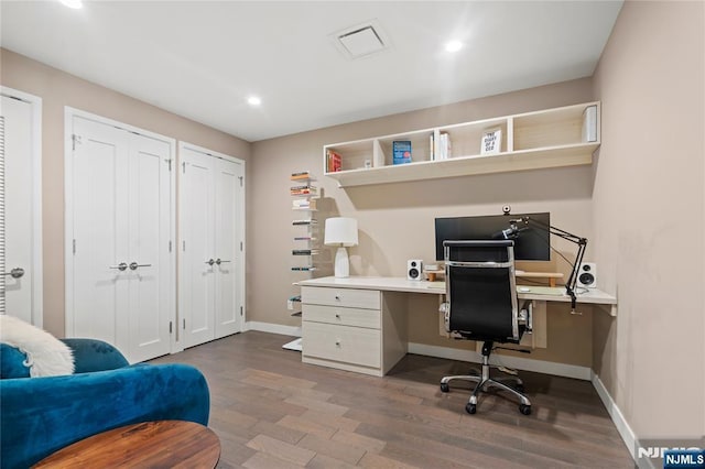 office area featuring visible vents, baseboards, wood finished floors, and recessed lighting