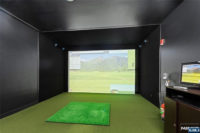 recreation room with golf simulator