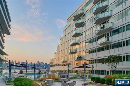 property at dusk featuring a city view