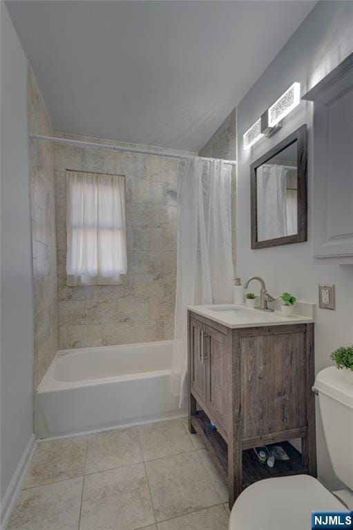 full bath featuring tile patterned flooring, toilet, vanity, vaulted ceiling, and shower / bath combo