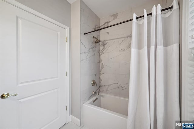 bathroom featuring shower / bath combo with shower curtain