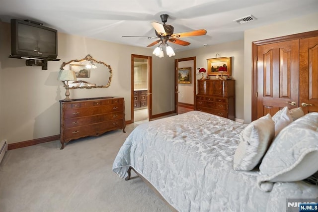 bedroom with a ceiling fan, light colored carpet, visible vents, and baseboards