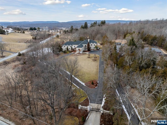 birds eye view of property with a rural view