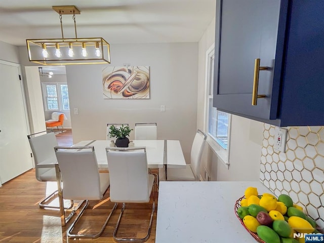 dining space featuring wood finished floors