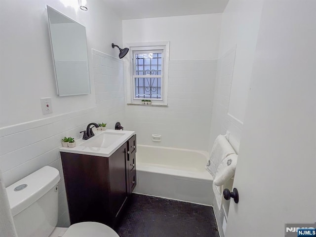 bathroom featuring toilet,  shower combination, wood finished floors, and vanity