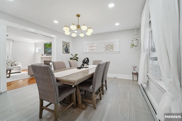 dining space with recessed lighting, plenty of natural light, and baseboards