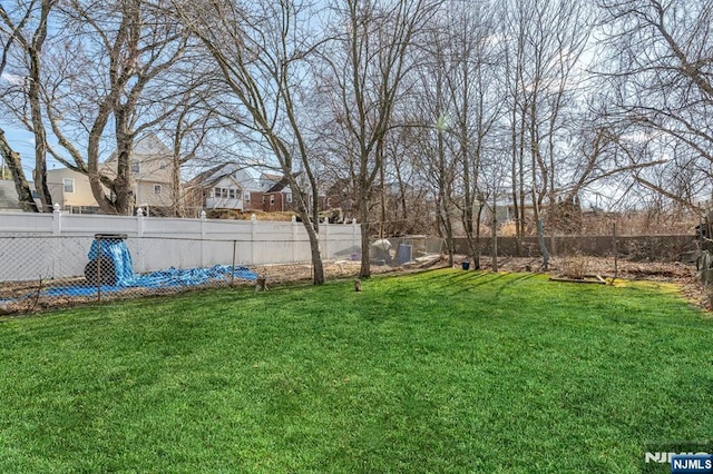 view of yard featuring a fenced backyard