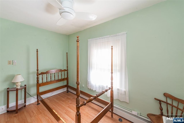 bedroom featuring light wood-style flooring and baseboards