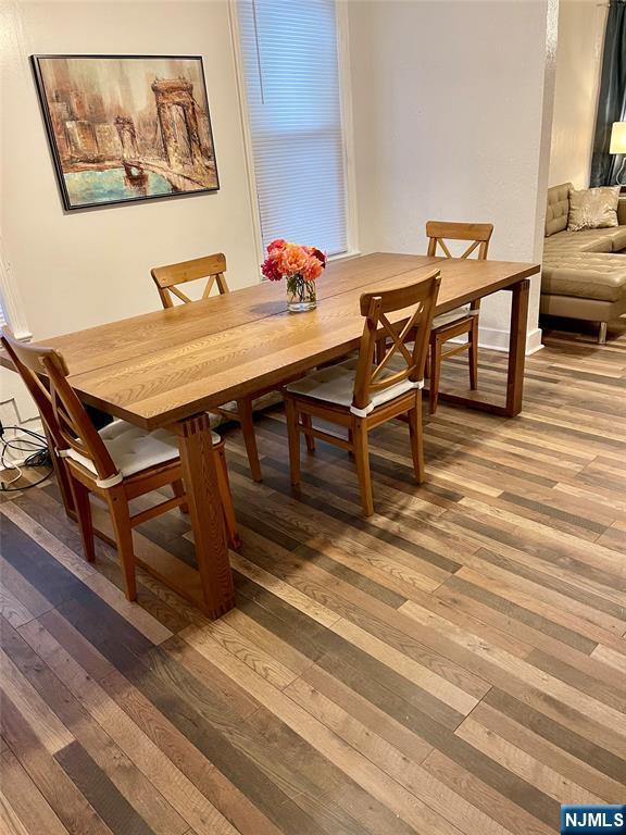 dining area with light wood-style floors