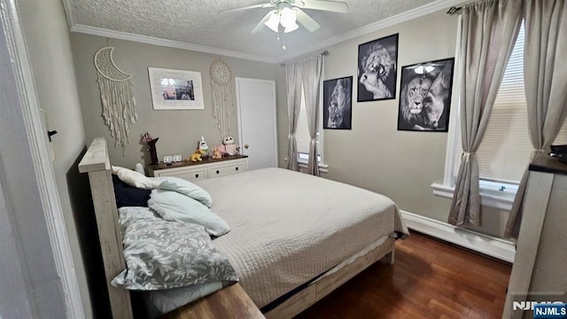 bedroom featuring baseboard heating, ornamental molding, a ceiling fan, a textured ceiling, and wood finished floors