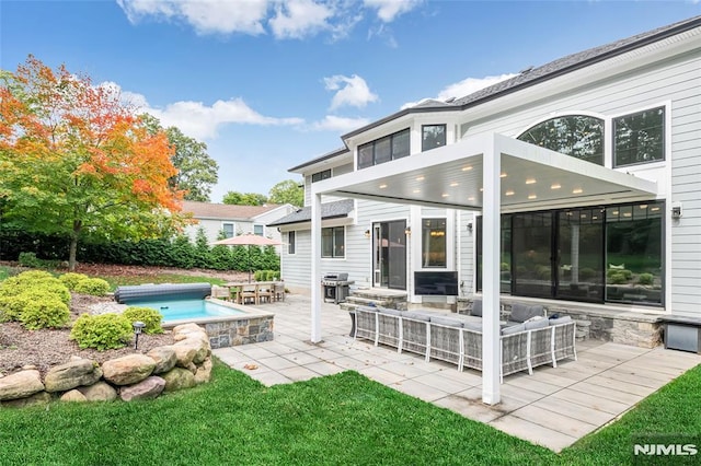 back of house featuring an outdoor hangout area, a fenced in pool, and a patio