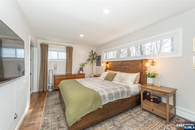 bedroom with wood finished floors and recessed lighting