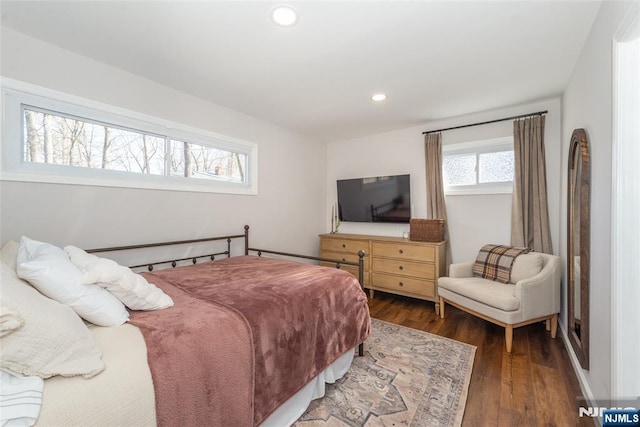 bedroom with wood finished floors and recessed lighting