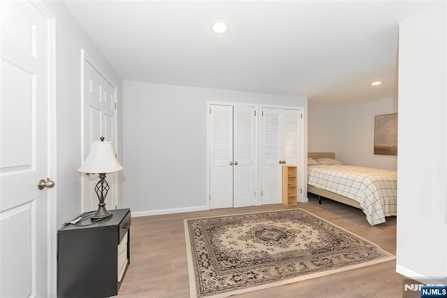 bedroom featuring recessed lighting, baseboards, and wood finished floors