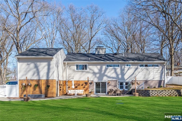 back of house with a yard, a patio area, fence, and an outdoor living space