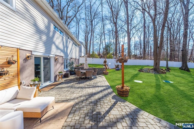 view of patio / terrace with a fenced backyard and outdoor lounge area