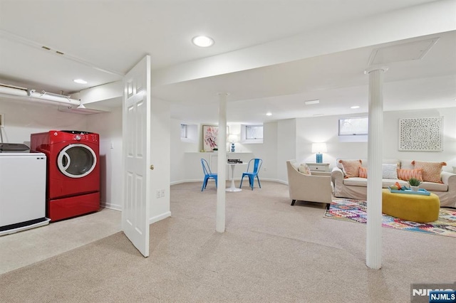 basement featuring carpet floors, baseboards, washer and dryer, and recessed lighting