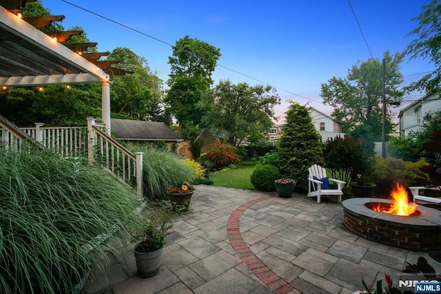 view of patio / terrace featuring a fire pit and a pergola