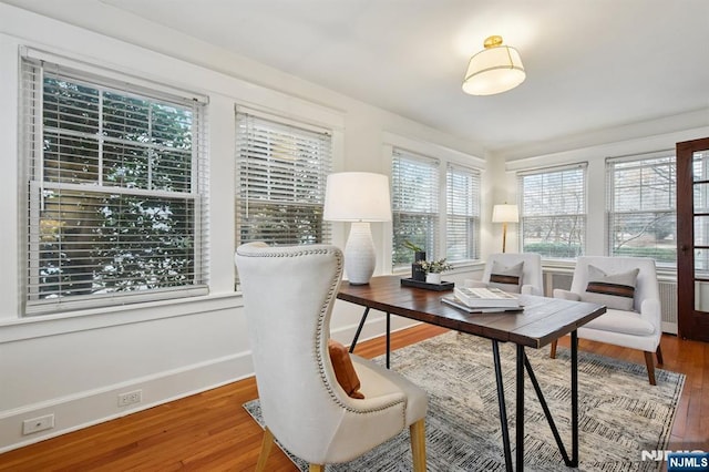 office featuring baseboards and wood finished floors