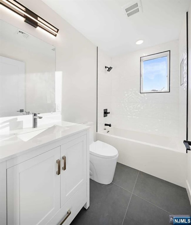 bathroom featuring visible vents, toilet, shower / tub combination, tile patterned flooring, and vanity