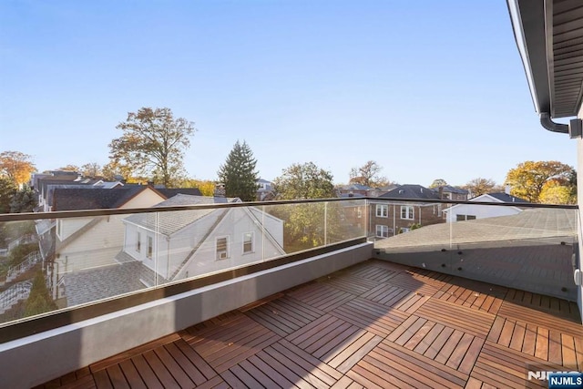 wooden deck featuring a residential view