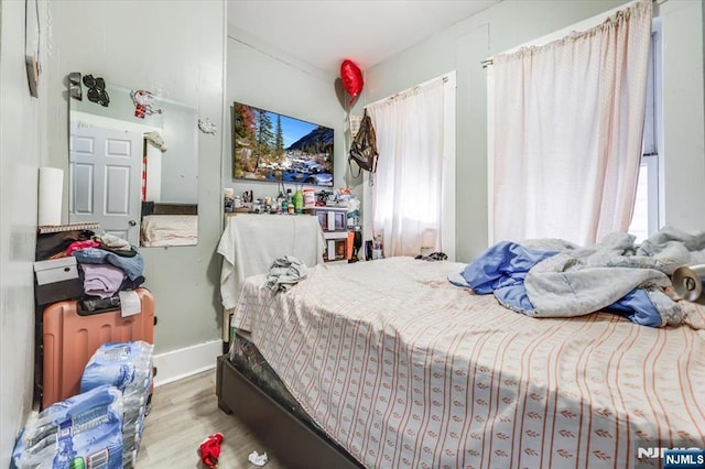 bedroom with wood finished floors