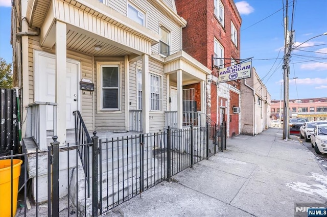 view of exterior entry with fence