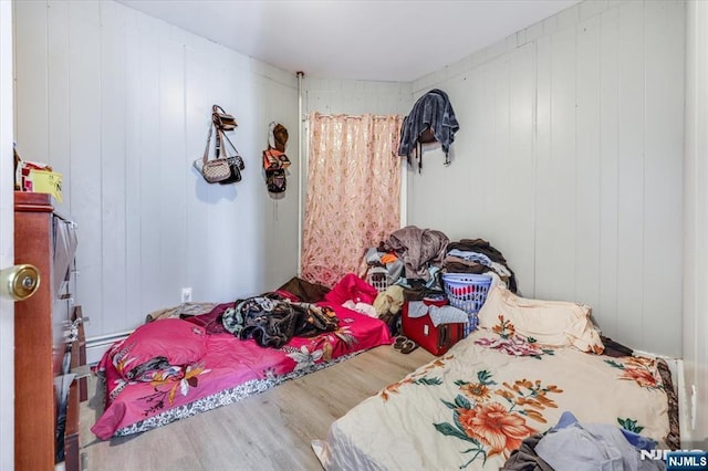 bedroom with wood finished floors