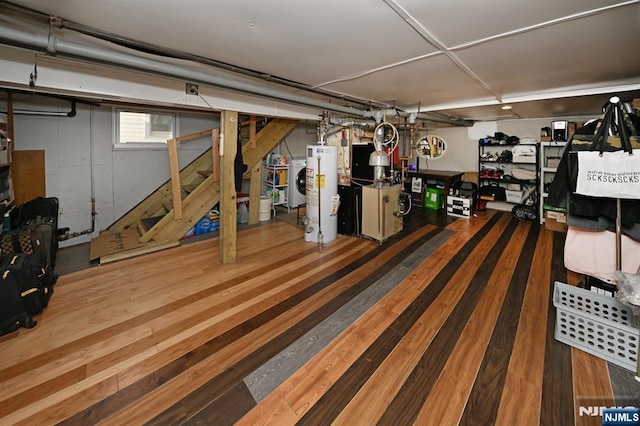 below grade area featuring gas water heater and wood finished floors