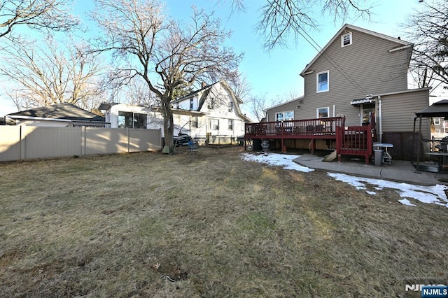 view of yard featuring a deck and a fenced backyard