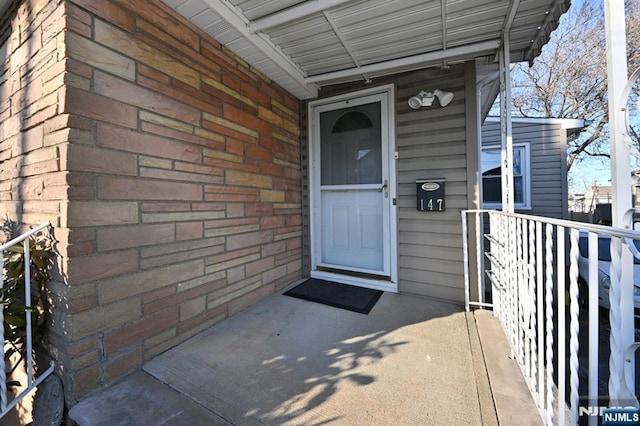 property entrance with brick siding