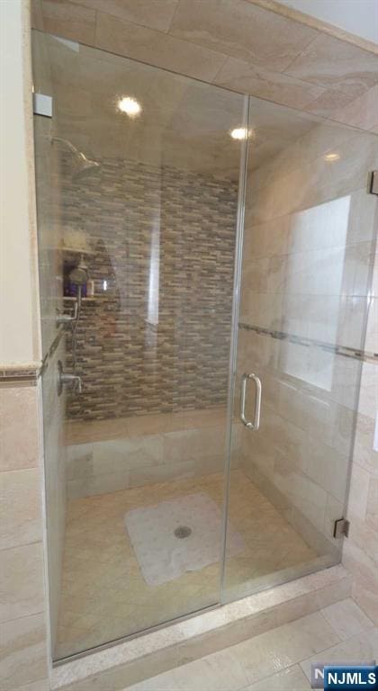 bathroom with a shower stall