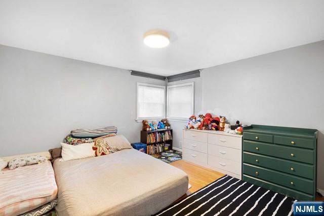 bedroom with light wood-style floors