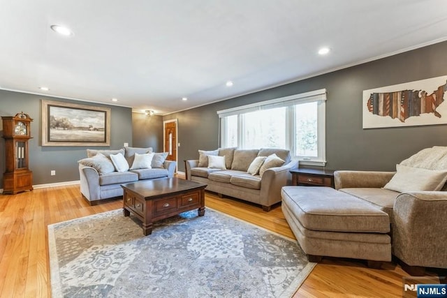 living area with recessed lighting, baseboards, crown molding, and light wood finished floors