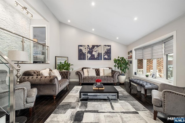 living room featuring vaulted ceiling, recessed lighting, wood finished floors, and baseboards