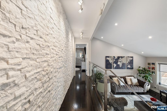 hall featuring recessed lighting, dark wood-style flooring, and vaulted ceiling